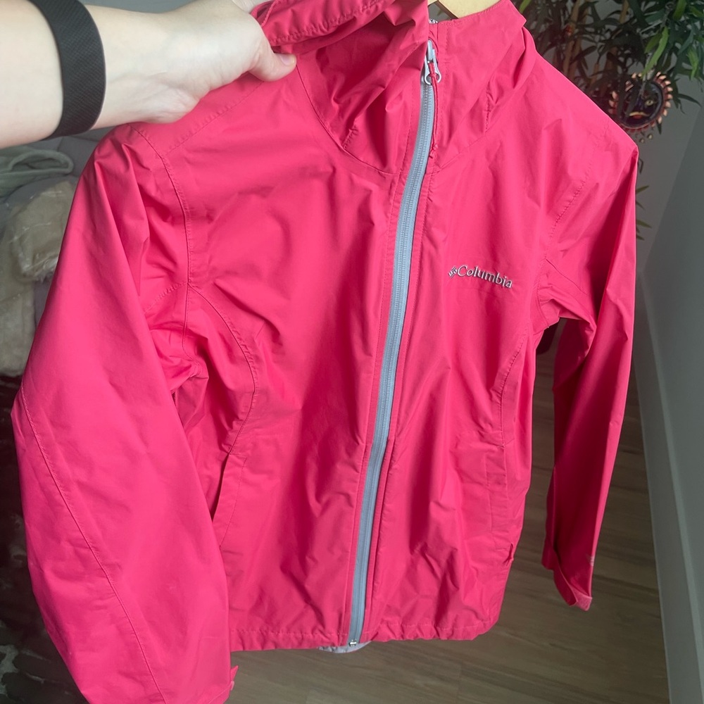 Bright pink Columbia waterproof and breathable jacket